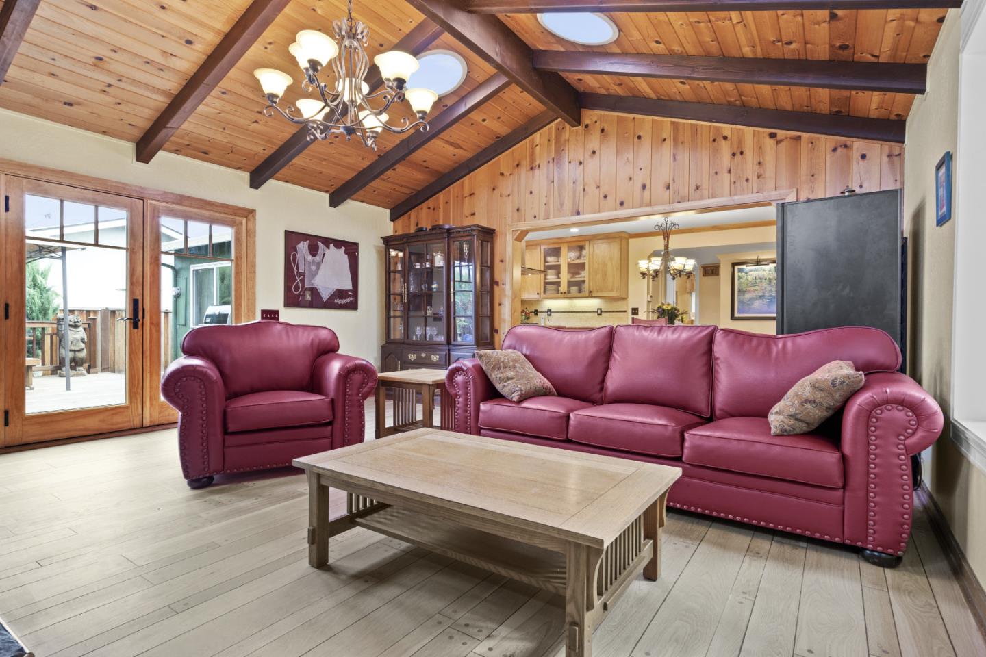 2841 Pruneridge Avenue Santa Clara, CA 95051 - Photo 28 of 53 a living room with furniture a wooden floor and a chandelier