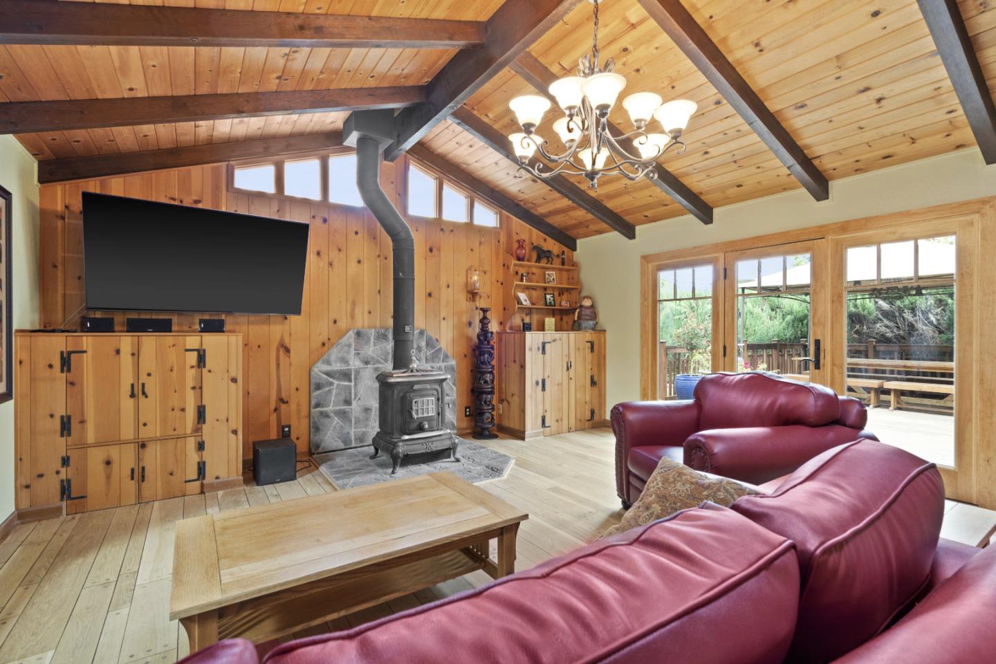 2841 Pruneridge Avenue Santa Clara, CA 95051 - Photo 29 of 53 a living room with furniture a flat screen tv and a floor to ceiling window