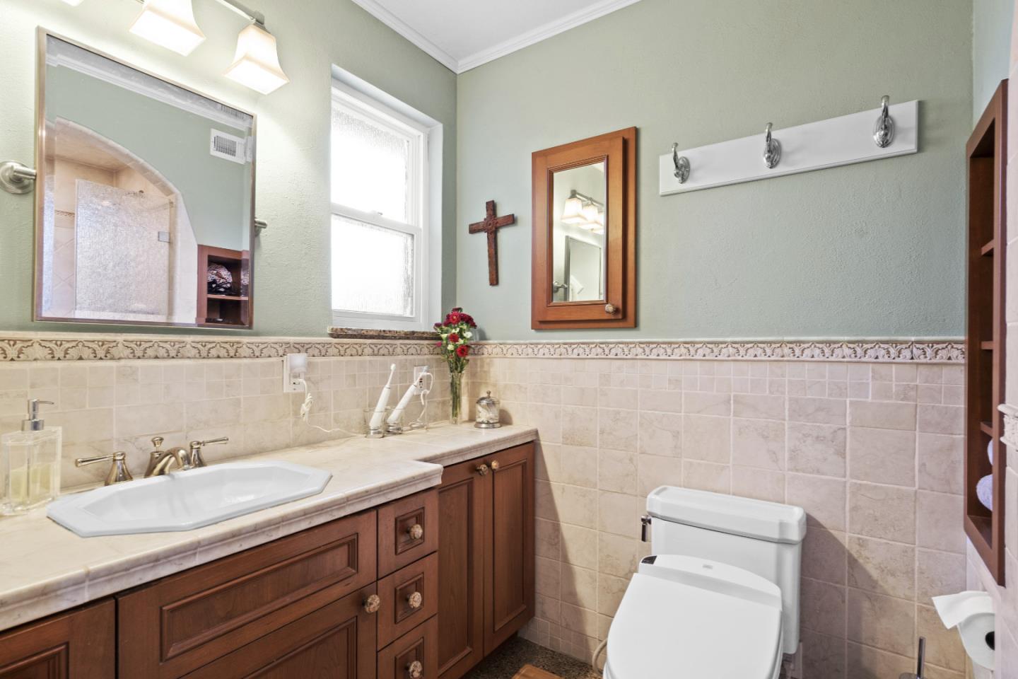 2841 Pruneridge Avenue Santa Clara, CA 95051 - Photo 35 of 53 a bathroom with a granite countertop toilet sink and mirror