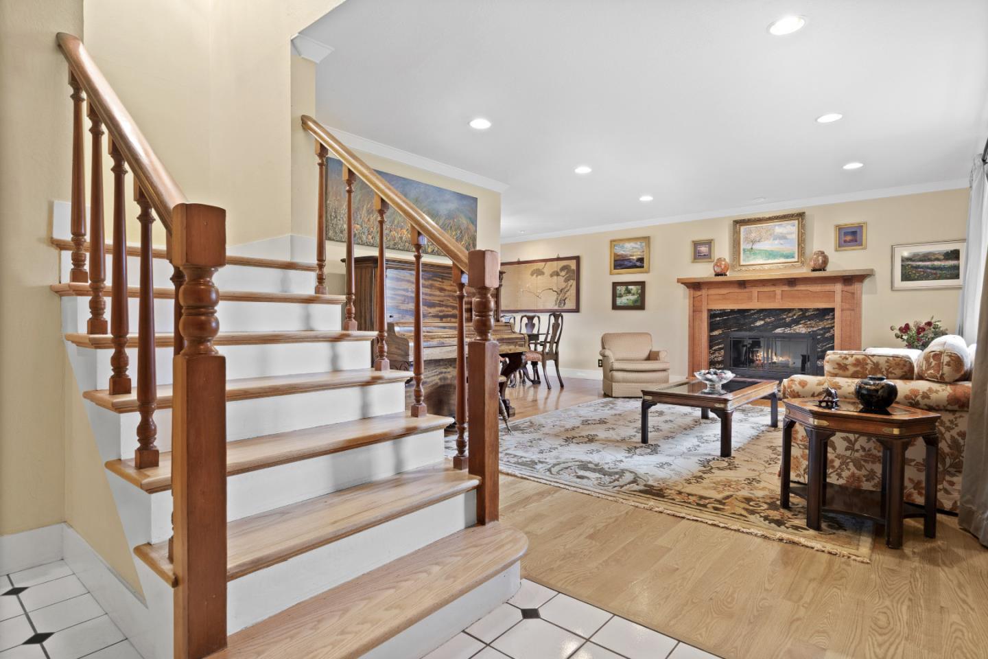 2841 Pruneridge Avenue Santa Clara, CA 95051 - Photo 8 of 53 a living room with furniture or wooden floor and a fireplace