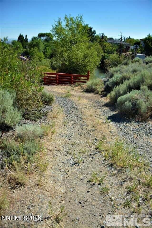 3245 Markridge Drive, Unit 9 Reno, NV 89509 - Photo 7 of 11 a view of a dry yard with wooden fence