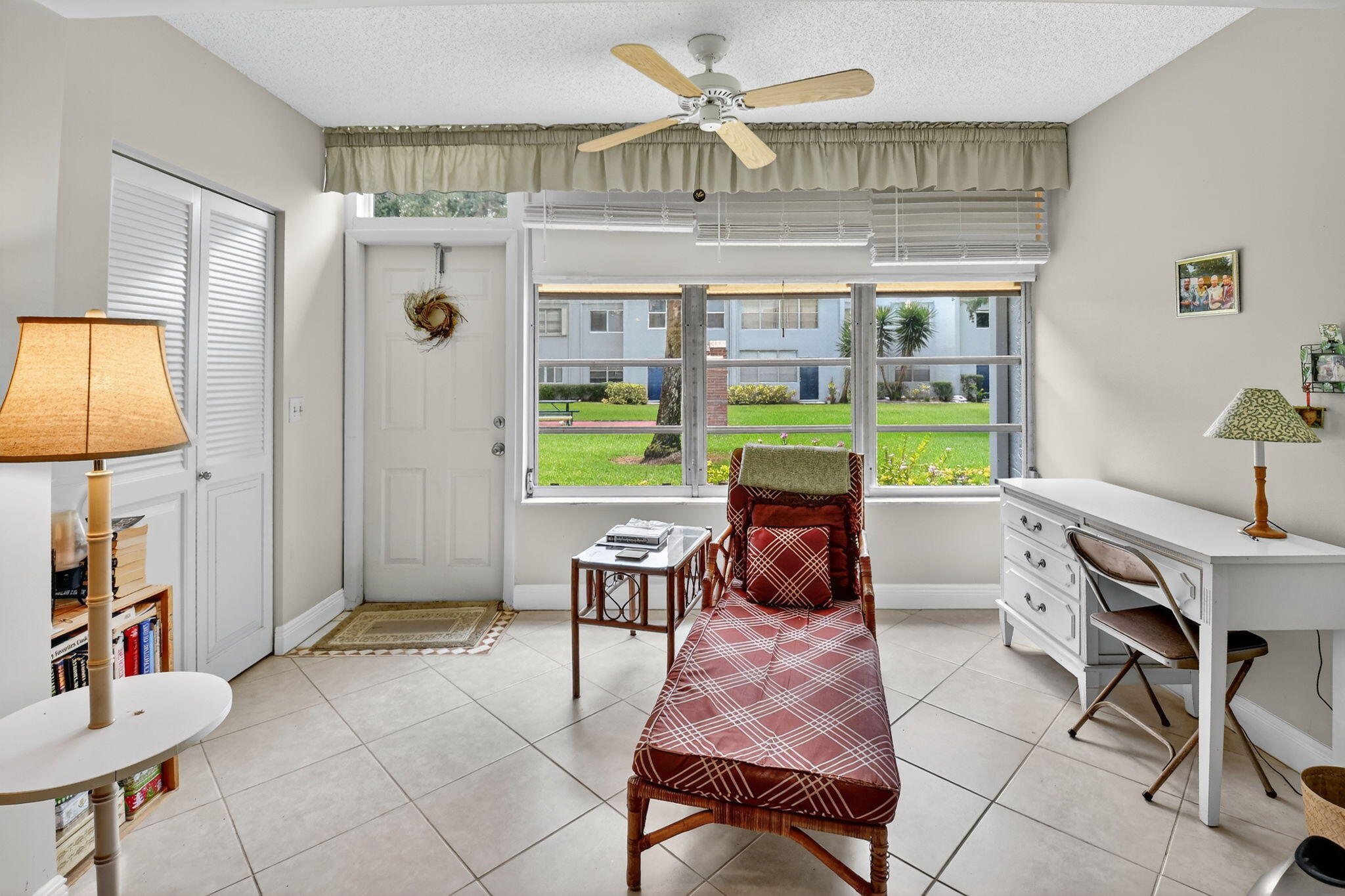 2860 Southwest 22nd Avenue, Unit 4030 Delray Beach, FL 33445 - Photo 14 of 37 a workspace with furniture and a window
