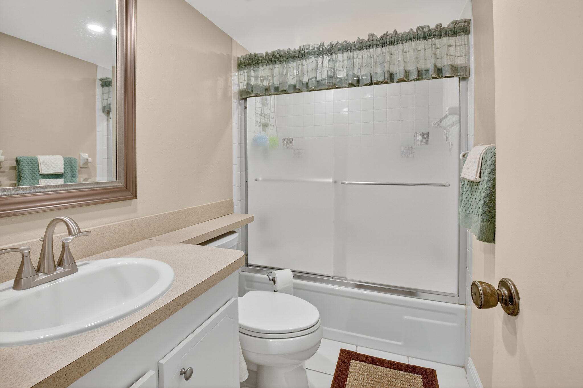 2860 Southwest 22nd Avenue, Unit 4030 Delray Beach, FL 33445 - Photo 19 of 37 a bathroom with a sink a toilet and shower