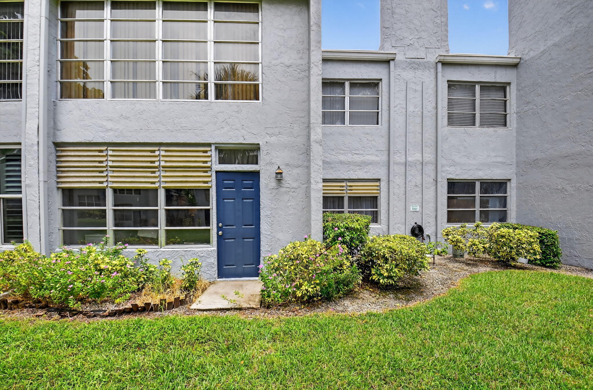 2860 Southwest 22nd Avenue, Unit 4030 Delray Beach, FL 33445 - Photo 25 of 37 a house view with a garden space
