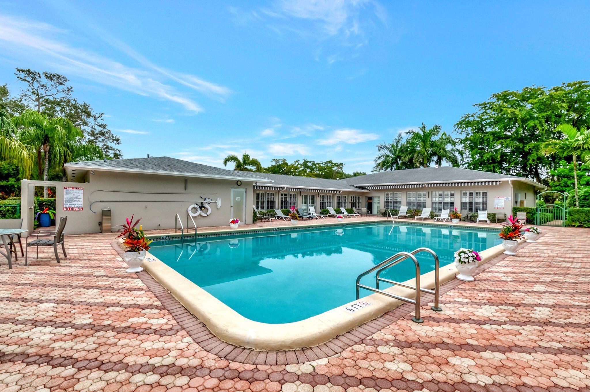 2860 Southwest 22nd Avenue, Unit 4030 Delray Beach, FL 33445 - Photo 31 of 37 a view of a house with swimming pool