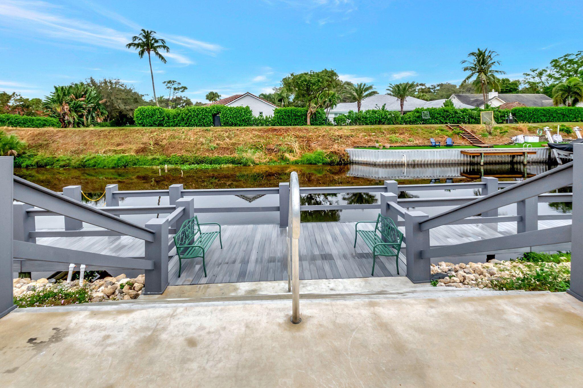 2860 Southwest 22nd Avenue, Unit 4030 Delray Beach, FL 33445 - Photo 35 of 37 a view of a patio with a table and chairs