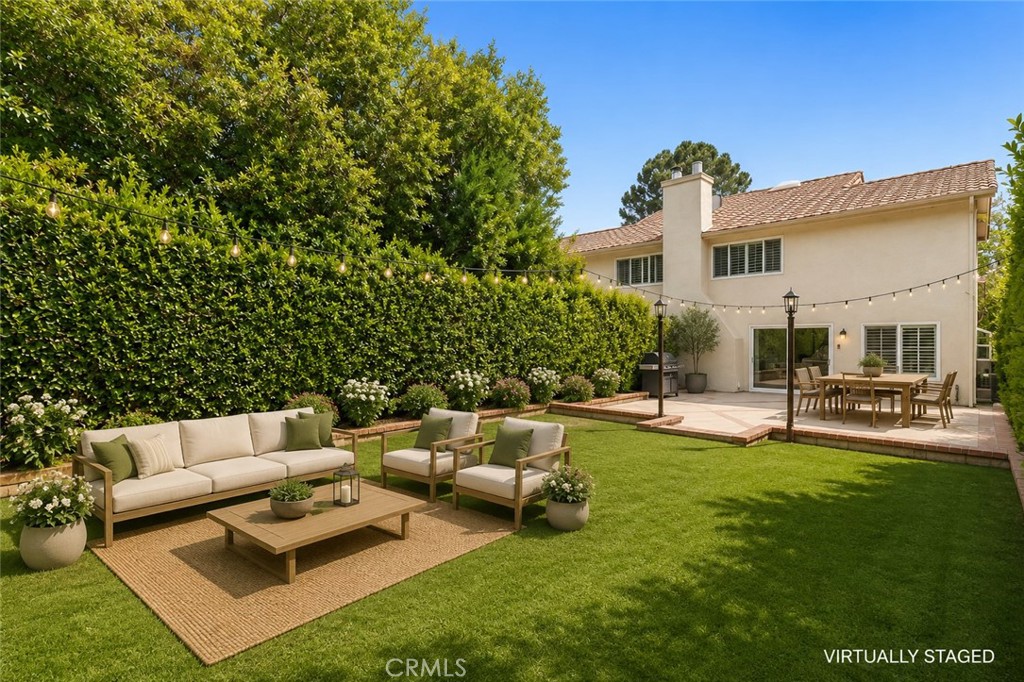 19451 Eagle Ridge Lane Porter Ranch, CA 91326 - Photo 49 of 59 a view of a house with couches and a table and chairs