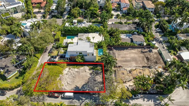 an aerial view of a yard with table and chairs