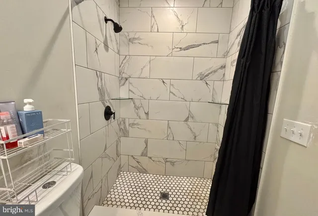 a bathroom with a sink and a shower