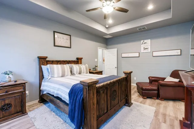 a bedroom with bed and window