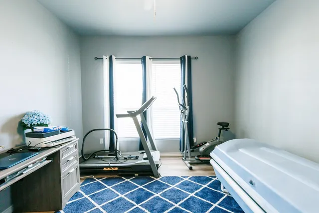 a bedroom with furniture and a window