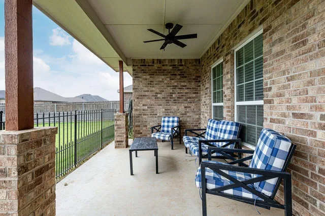 a view of a backyard with sitting area