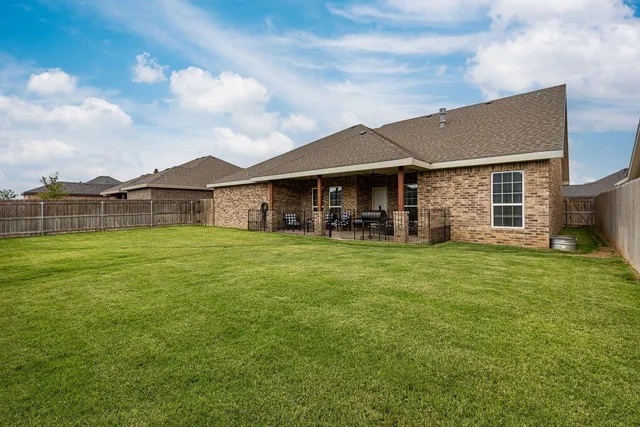 a front view of house with outdoor seating yard and porch