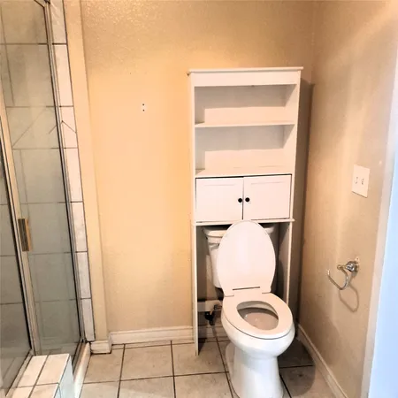 a bathroom with a toilet and a sink