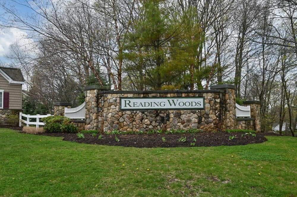 57 Augustus Court, Unit 1010 Reading, MA 01867 - Photo 2 of 32 a view of street sign
