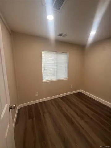 a view of a livingroom with a washer and dryer