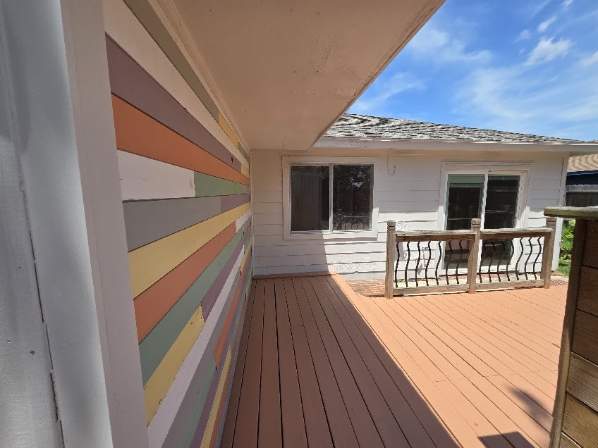 1110 Greencroft Street Channelview, TX 77530 - Photo 19 of 24 a view of a balcony with wooden floor and fence