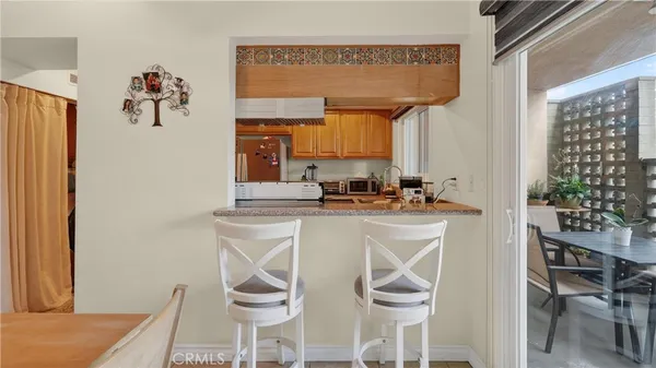 a kitchen with a table and chairs