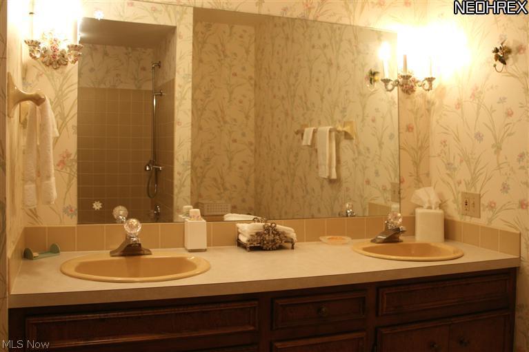 2330 Lancaster Road Akron, OH 44313 - Photo 12 of 18 Full Bath with double vanity. Note shower/tub reflected in mirror.