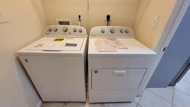 a utility room with dryer and washer