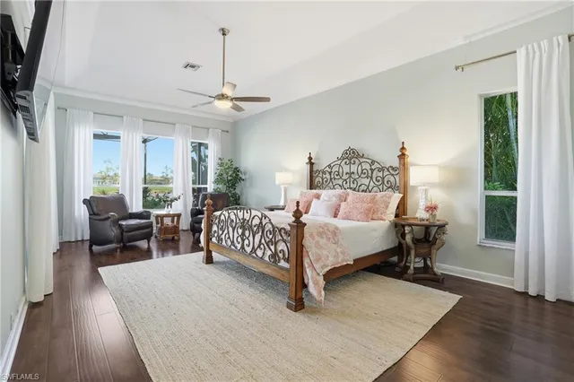 a bedroom with furniture and a chandelier