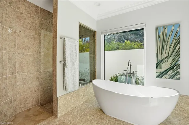 a bed room with a bed and a chair