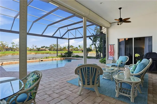 a view of a swimming pool with a patio