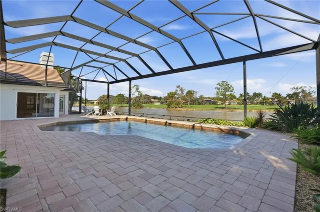 a view of a backyard with sitting area