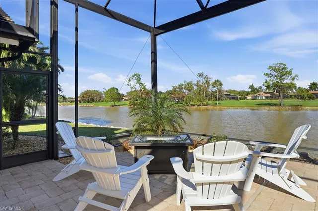 a bathroom with a granite countertop sink a toilet a mirror and shower