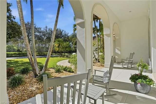 a view of a balcony with wooden floor and outdoor space