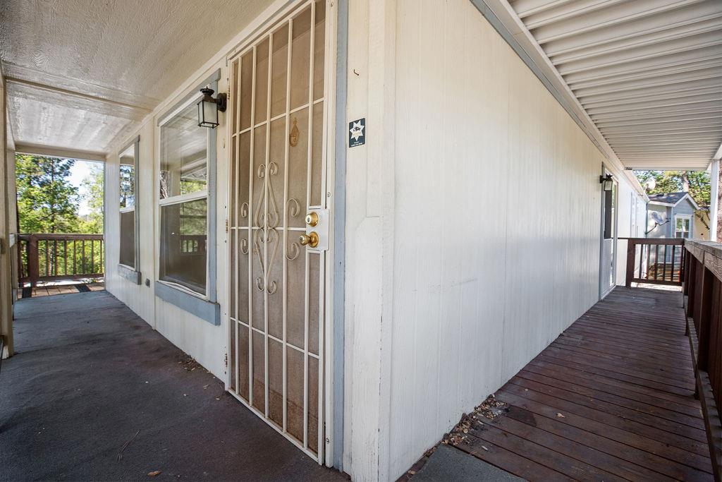 1281 Pleasant Valley Road, Unit 44 Diamond Springs, CA 95619 - Photo 25 of 27 a view of a hallway with wooden floor and staircase