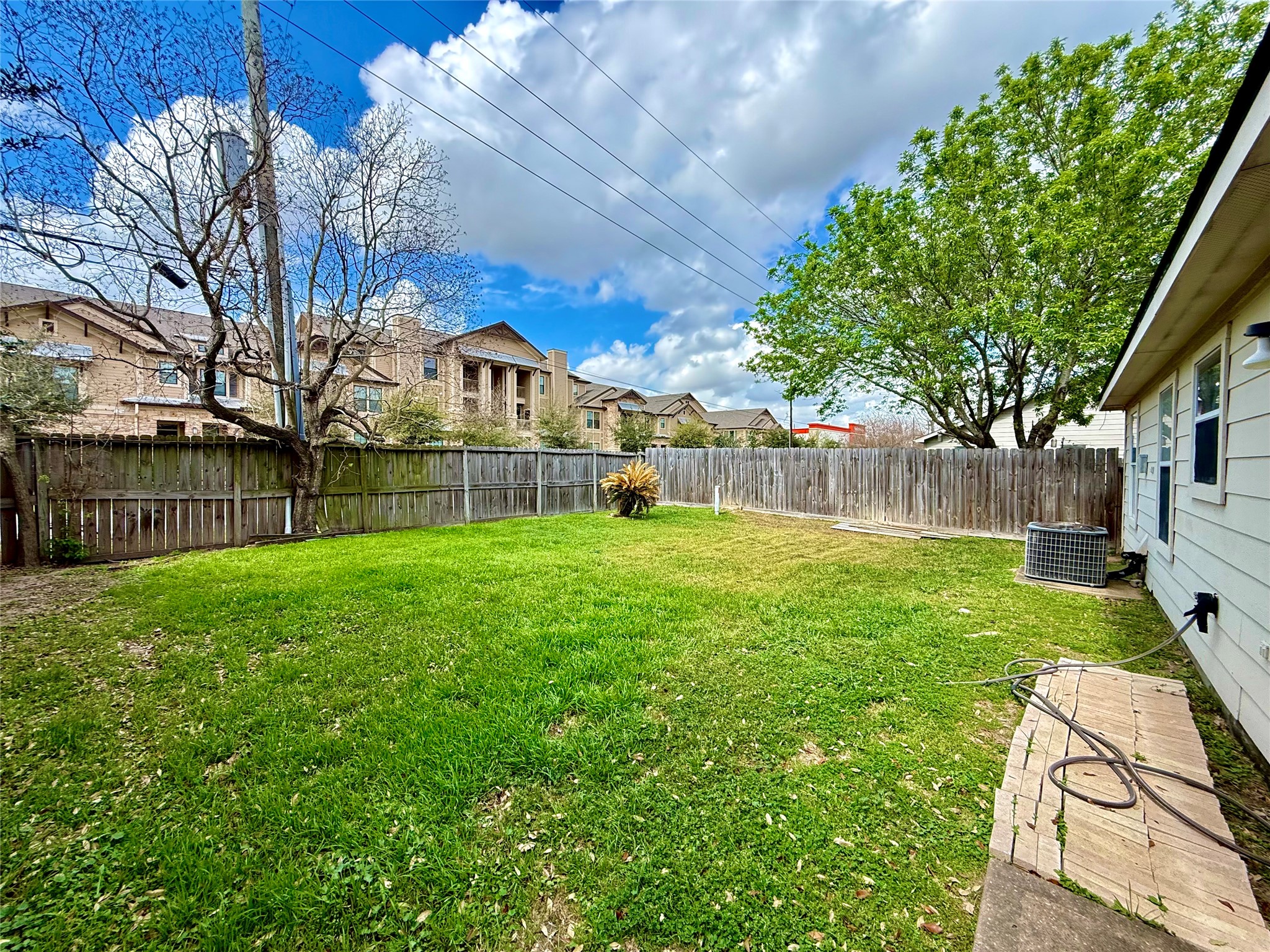 3819 Banks Ridge Lane Katy, TX 77449 - Photo 12 of 13 a front view of a house with garden and a tree