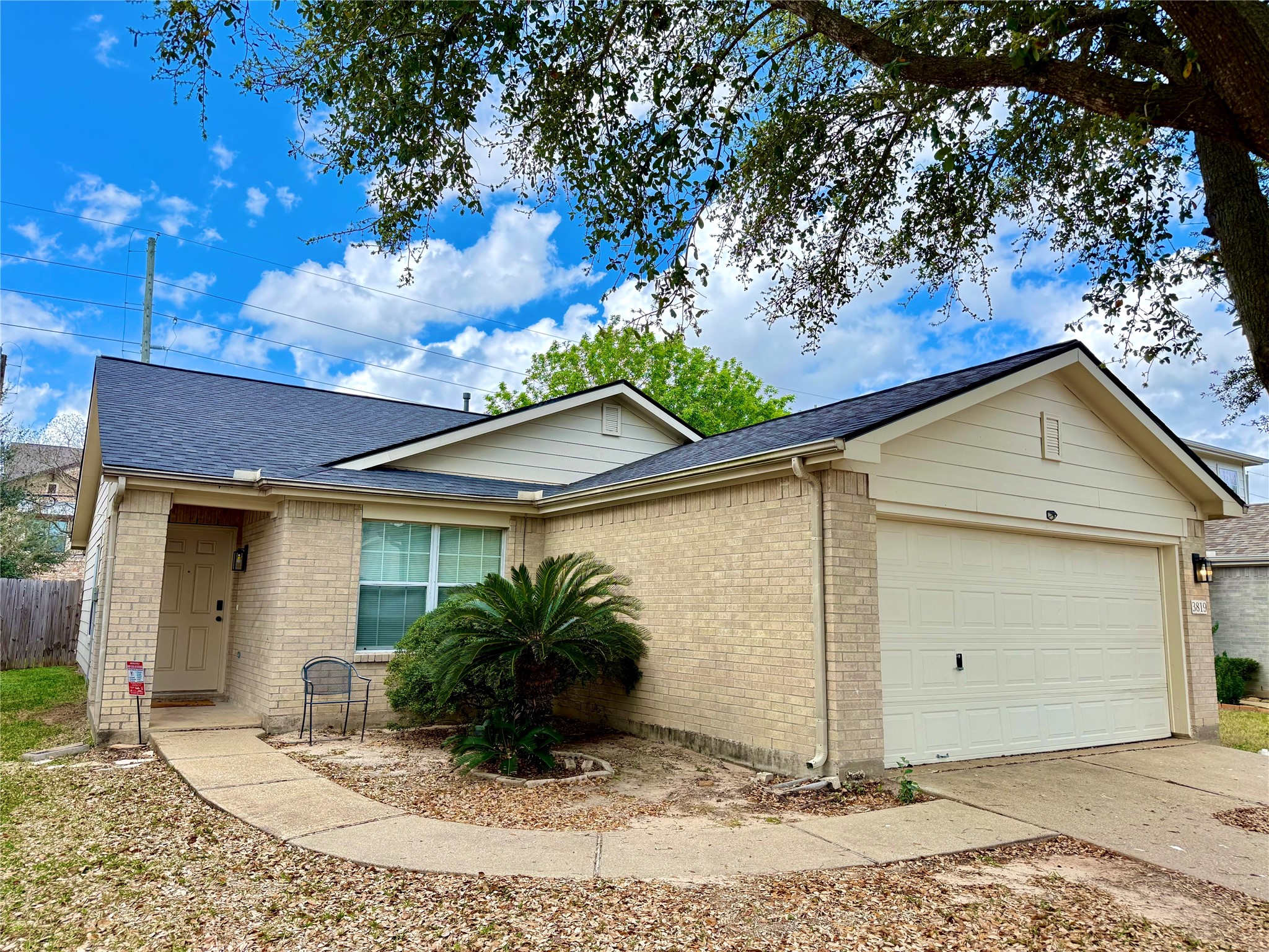 3819 Banks Ridge Lane Katy, TX 77449 - Photo 2 of 13 a view of a house with a yard plants and large tree