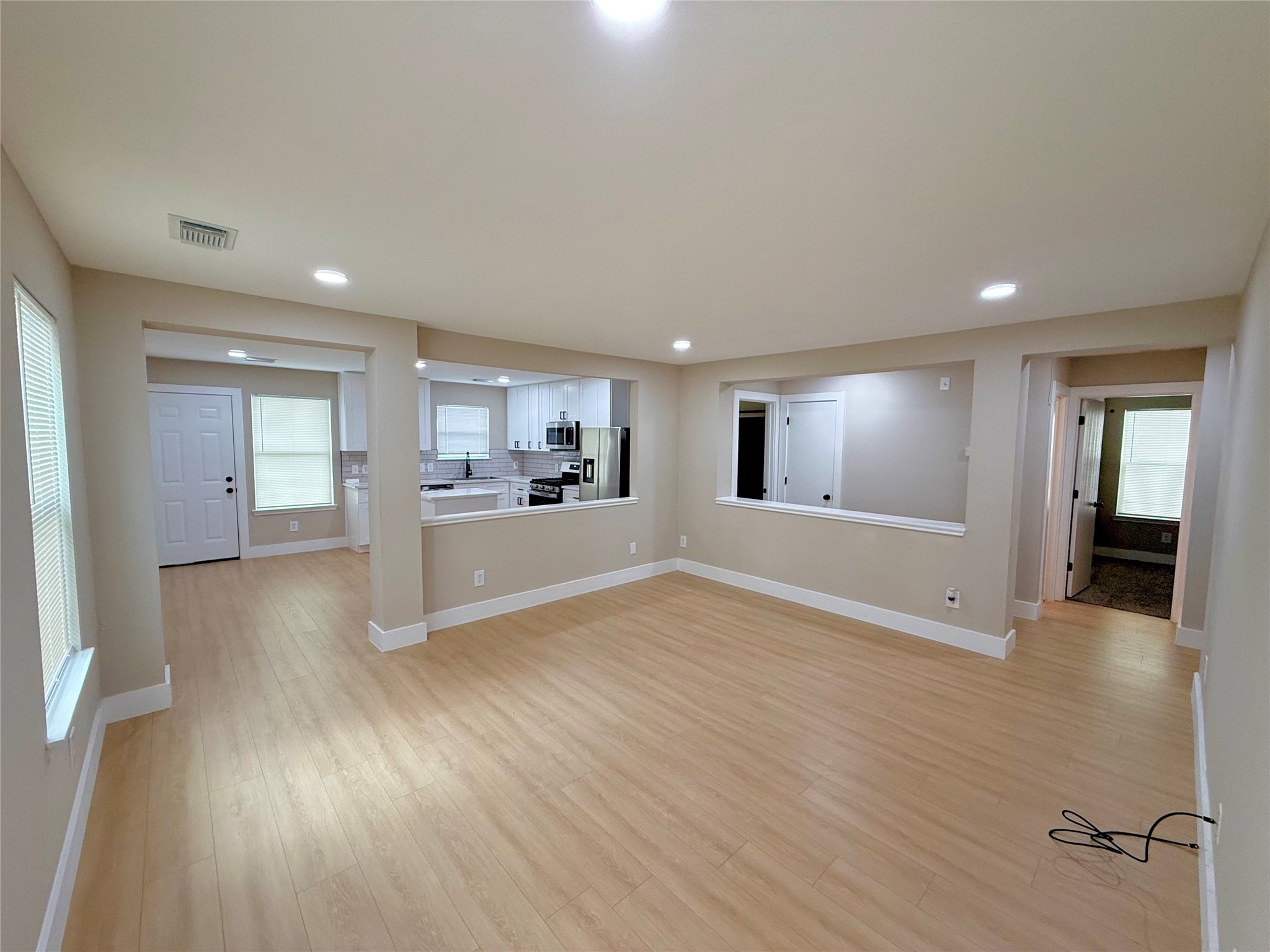 3819 Banks Ridge Lane Katy, TX 77449 - Photo 3 of 13 a view of a big room with wooden floor and windows