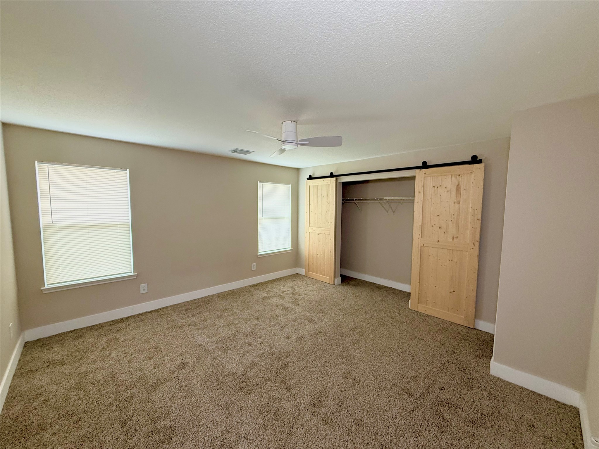 3819 Banks Ridge Lane Katy, TX 77449 - Photo 9 of 13 an empty room with windows and closet