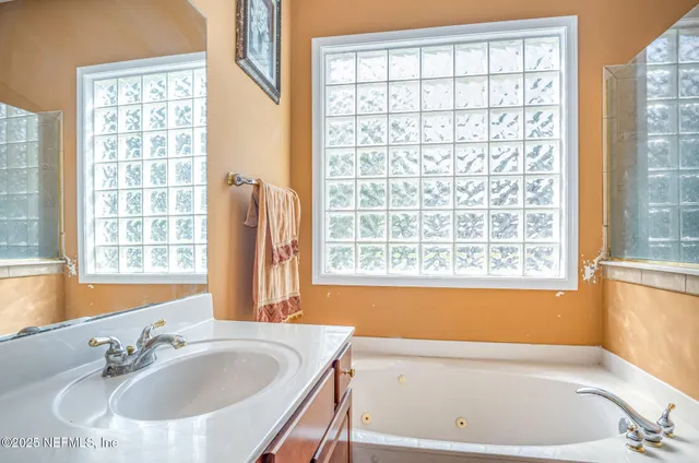 a bathroom with sink and bathtub