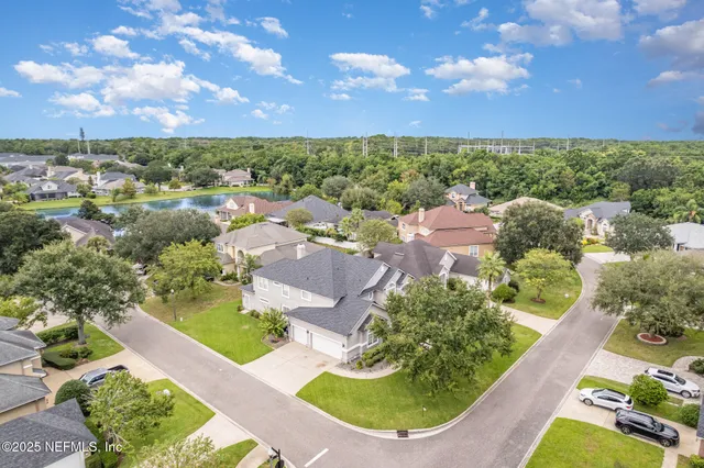 an aerial view of a house with a garden