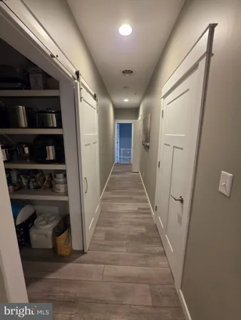 a view of entryway with stairs and wooden floor