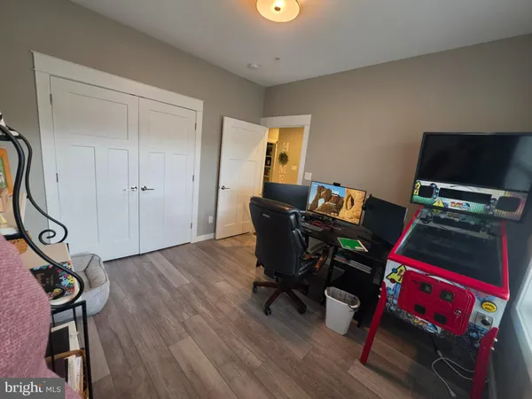 a workspace with furniture and wooden floor