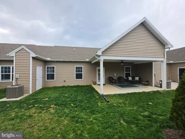 a front view of house with yard and porch