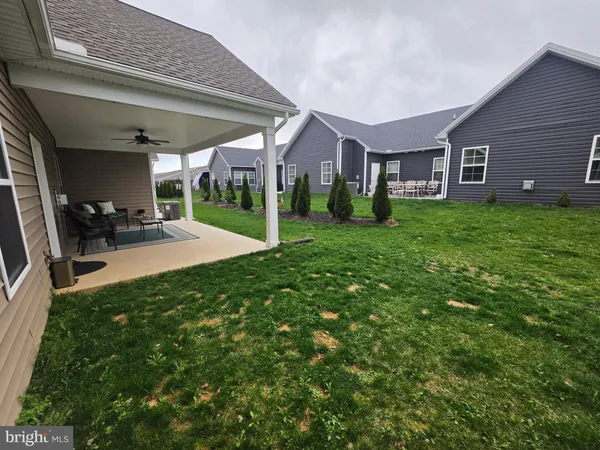 a view of a house with a yard porch and sitting area