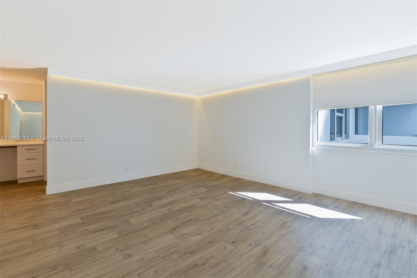 2030 South Ocean Drive, Unit 1127 Hallandale Beach, FL 33009 - Photo 14 of 39 an empty room with wooden floor and windows