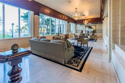 a room with furniture and pool table