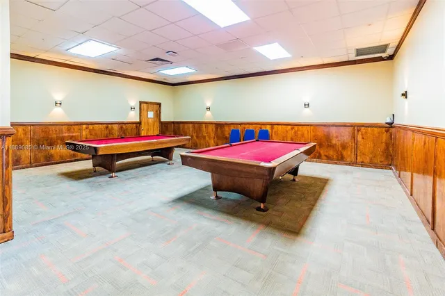 a room with furniture and pool table