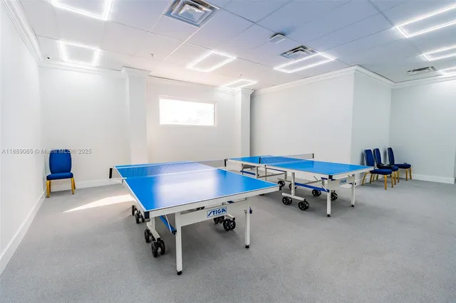 a room with gym equipment and a table