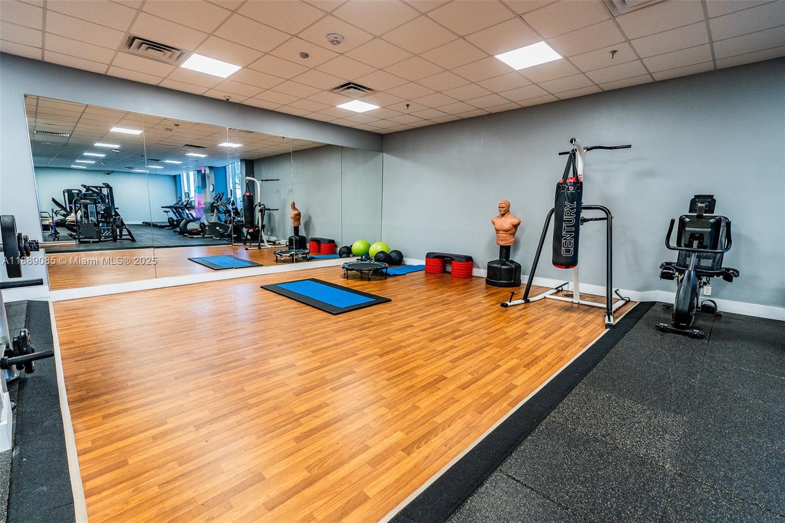 2030 South Ocean Drive, Unit 1127 Hallandale Beach, FL 33009 - Photo 28 of 39 a room with gym equipment and a table