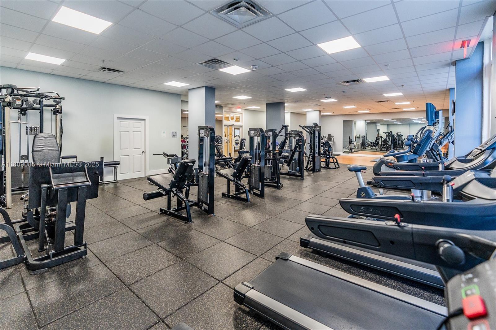 2030 South Ocean Drive, Unit 1127 Hallandale Beach, FL 33009 - Photo 30 of 39 a room with lots of gym equipment