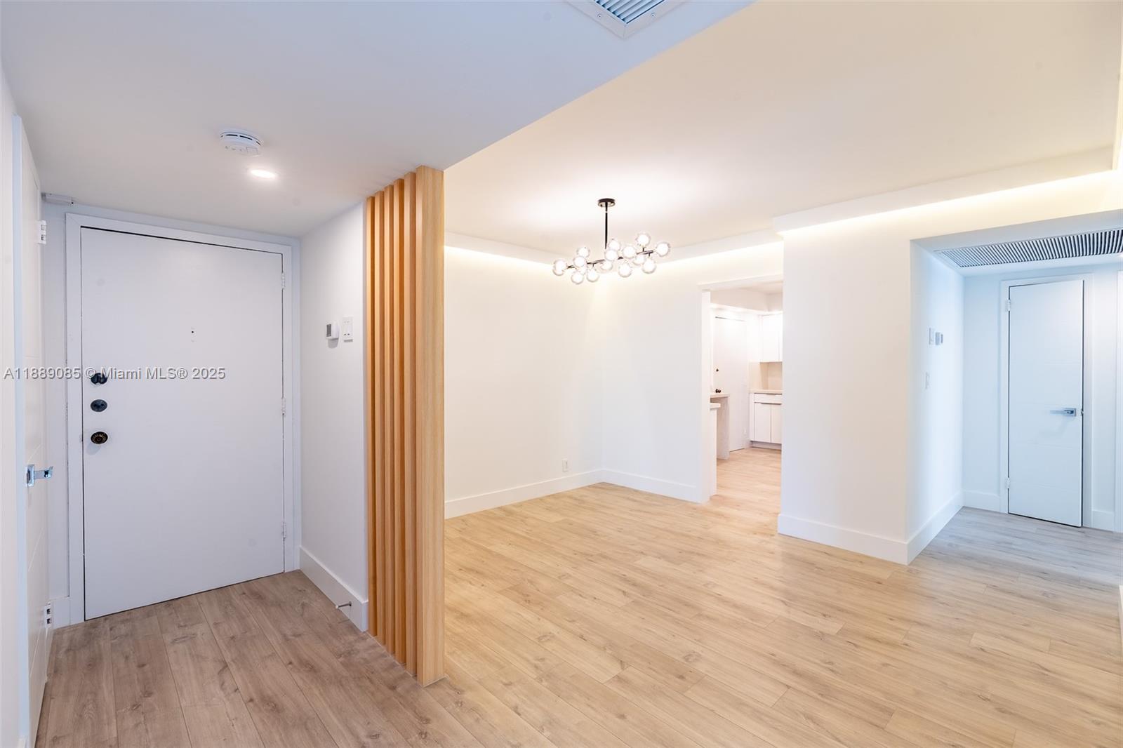 2030 South Ocean Drive, Unit 1127 Hallandale Beach, FL 33009 - Photo 3 of 39 wooden floor in an empty room with a window