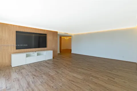 a living room with a flat screen tv