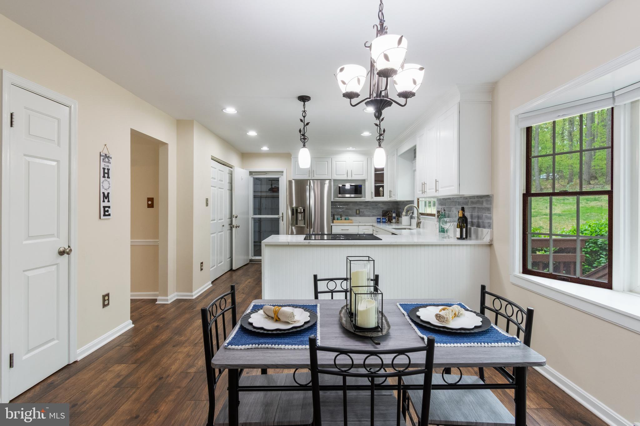 4036 Roop Road New Windsor, MD 21776 - Photo 12 of 55 a view of a dining room that has a table and chairs in it